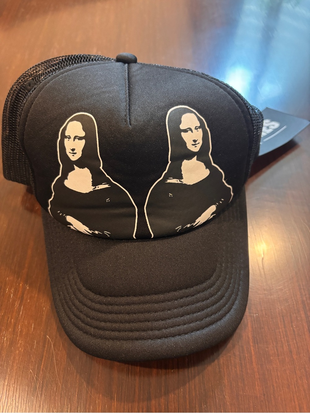 PLEASURES Black Trucker Hat with Double Mona Lisa Graphic - Men Accessories Hats